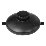 Zwart kunststof voetschakelaar met ronde knop, bovenaanzicht, geschikt voor bediening van verlichting of elektrische apparaten.