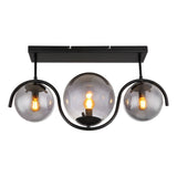 Zwarte plafondlamp met drie rookglazen bollen en zichtbare filamentlampen, vooraanzicht.