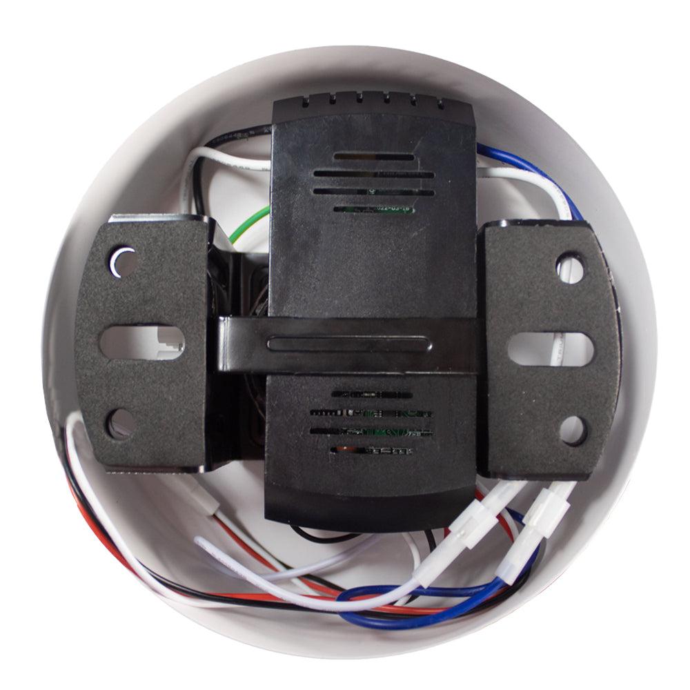 Bovenzicht van een elektronische spanningsverdeler in een ronde kunststof behuizing met zichtbare bedrading en montagesteunen.