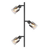 Moderne zwarte vloerlamp met drie verstelbare rookglas kappen en zichtbare filamentlampen, schuin zijaanzicht.