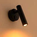 Zijaanzicht van een moderne zwarte LED leeslamp met wandmontage, schakelaar op de basis en warm wit licht, ideaal als bedlampje of wandverlichting.