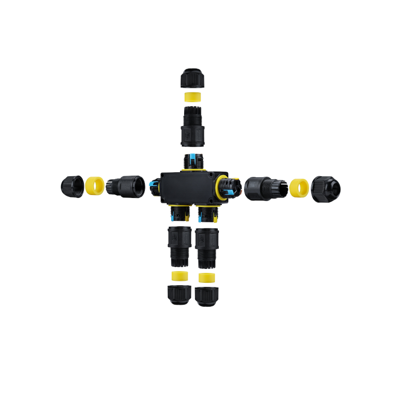 Exploded view van een waterdichte elektrische verbindingsdoos met meerdere kabelinvoeren, zwarte behuizing en gele afdichtingen, weergegeven vanuit een bovenaanzicht tegen een witte achtergrond.
