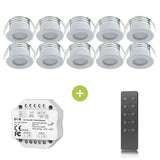 Set van 10 ronde LED inbouwspots in witte behuizing, inclusief RF-dimmermodule en afstandsbediening, vooraanzicht van alle componenten.