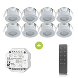 Set van 6 ronde LED inbouwspots in wit met aluminium afwerking, inclusief een draadloze RF dimmer en afstandsbediening, weergegeven in vooraanzicht.