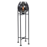 Moderne zwarte vloerlamp met glazen bol en zichtbare filamentlamp, volledig frontaal aanzicht.