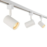 Wit 3-fase rail systeem met drie cilinder spotlampen, LED-verlichting, zijaanzicht, modern en minimalistisch design voor plafondmontage.