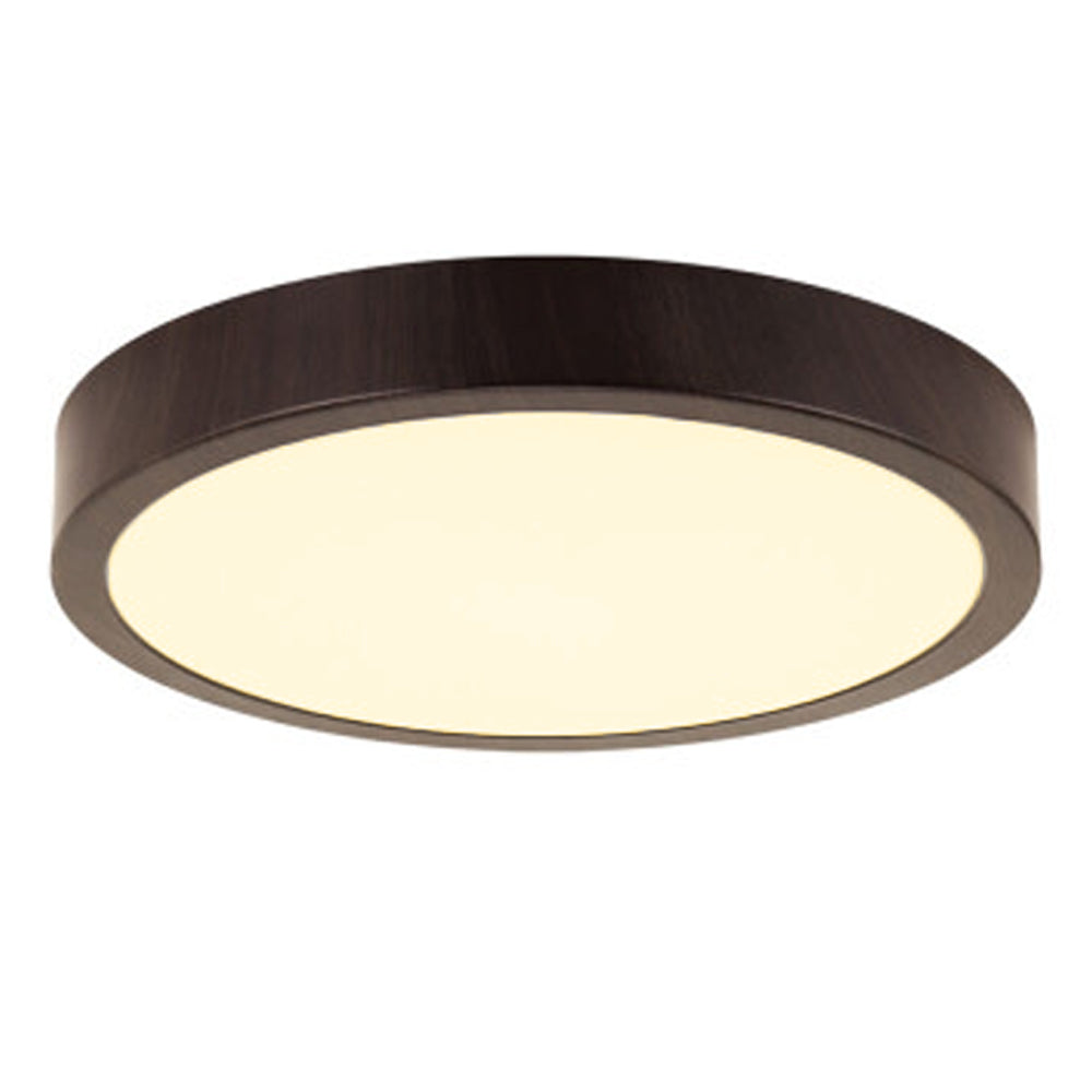 Moderne ronde LED plafondlamp met donkerhouten afwerking, warm wit licht en strak design – zijaanzicht schuin van onderen.
