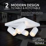 Wit moderne plafondlamp met vier kantelbare en roteerbare spotlights, afgebeeld in een schuine onderaanzicht tegen een sfeervolle interieurachtergrond; ontwerp met strakke lijnen en geschikt voor 220V aansluiting, lichtbronnen niet inbegrepen.