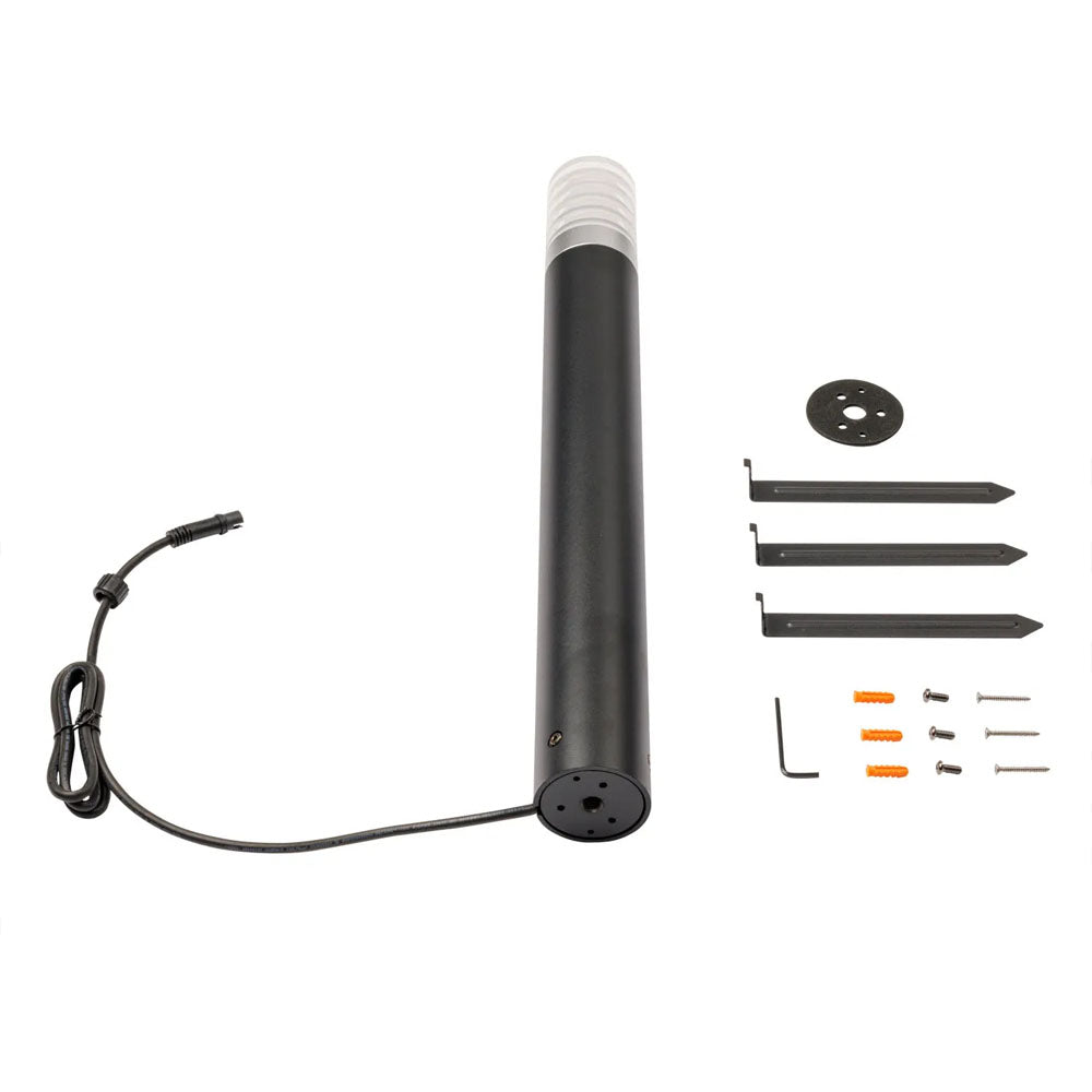 Zwarte LED tuinlamp met transparante kap, inclusief montagemateriaal en grondpinnen, gezien van bovenaf op een witte achtergrond.