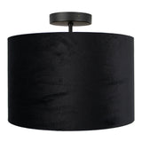 Zwarte velvet plafondlamp met cilindervormige kap, gezien vanuit een recht vooraanzicht tegen een witte achtergrond.