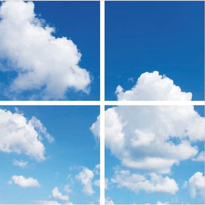 Vierdelige afbeelding van een strakblauwe lucht met witte wolken, gezien door een raamraster; frontaal aanzicht, ideaal als decoratief fotobehang of raamsticker met een rustgevend uitzicht.