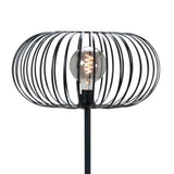 Zwarte design tafellamp met open metalen kooi en zichtbare filamentlamp, vooraanzicht.