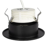 Zijaanzicht van een zwarte ronde inbouwspot fitting met witte keramische fitting en metalen bevestigingsklemmen, geschikt voor GU10 lampen.